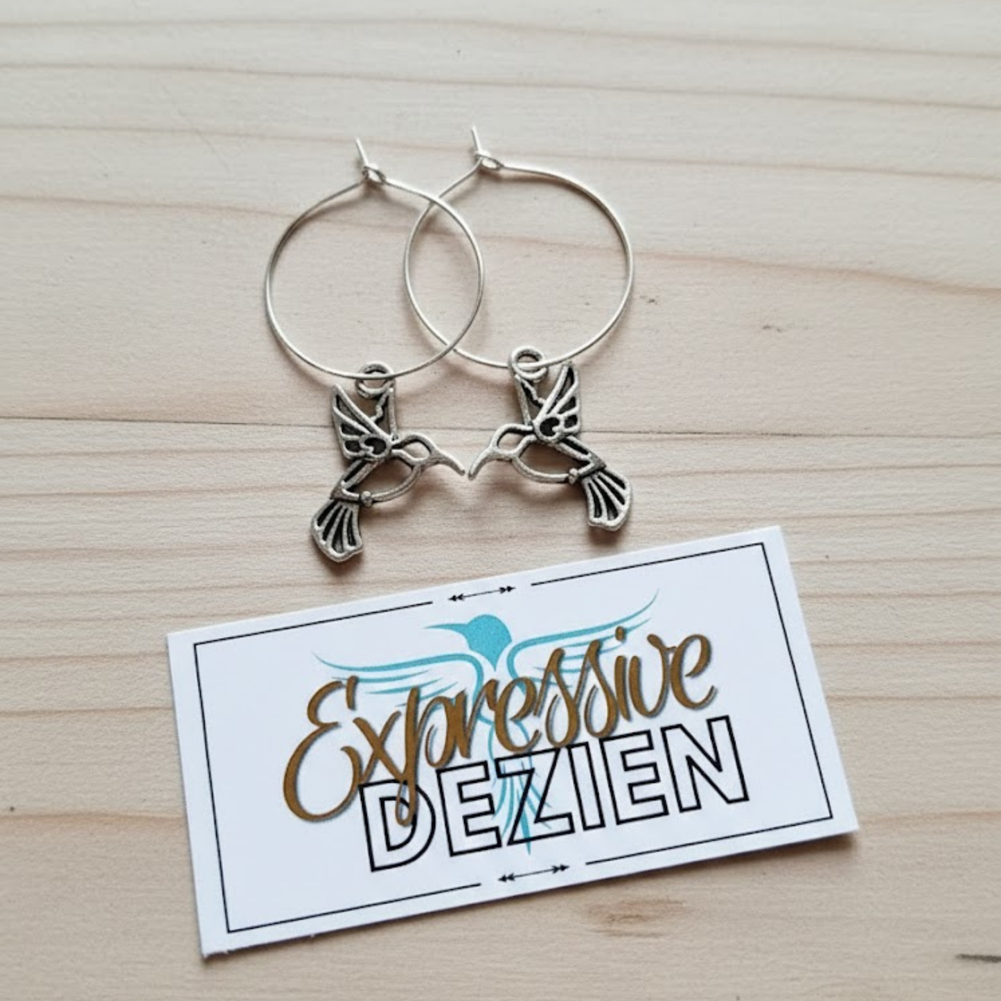 Signature Silver Hummingbird Hoop Earrings by Expressive DeZien included with "Her Snag" wine glass sets