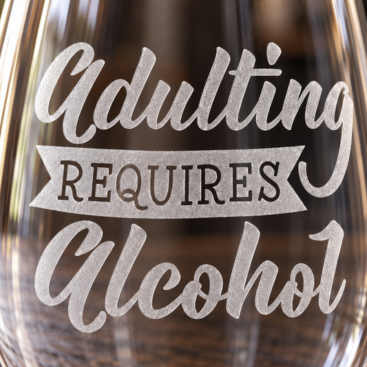 Adulting Requires Alcohol Sandblasted Stemless Wine Glass by Expressive DeZien with permanent sandblasted artwork