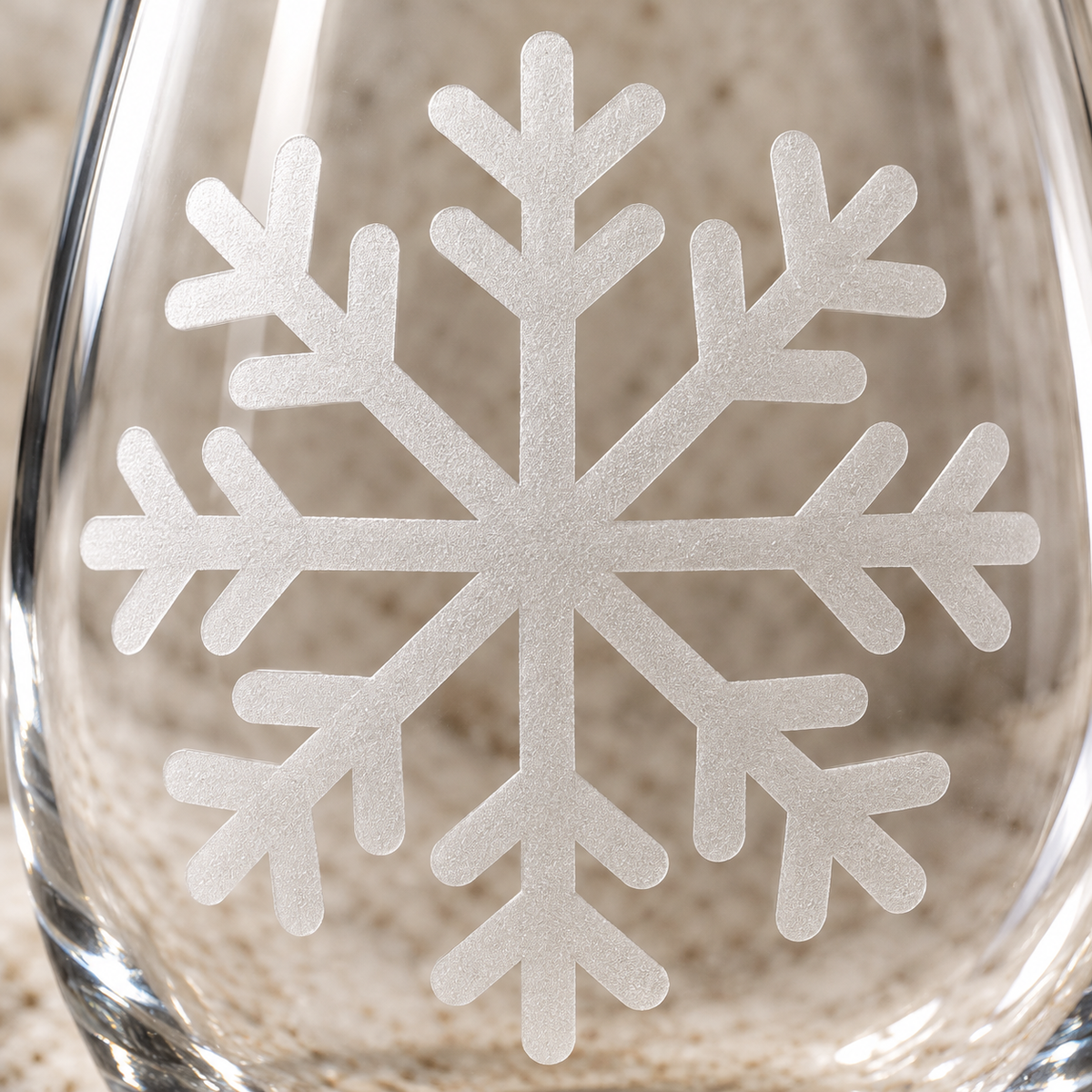 Winter's Whisper Snowflake design, permanently sandblasted on a clear 20.5 oz stemless wine glass, product view 2