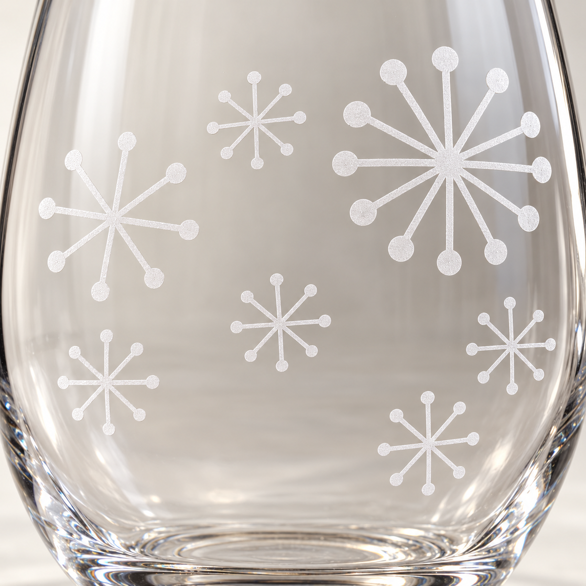 Retro Winter Snowflake design, permanently sandblasted on a clear 20.5 oz stemless wine glass, product view 2