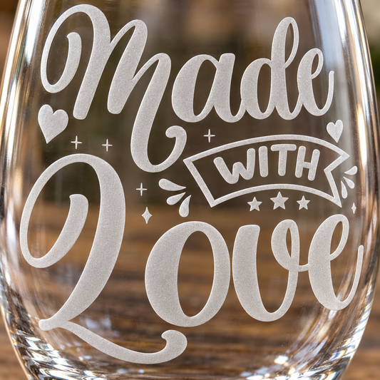 Made with Love Hearts & Banner etched stemless wine glass. Close view of the lettering, hearts, stars, and banner.