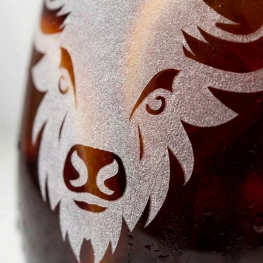 Stemless wine glass with a Bison sandblasted etched micro close up